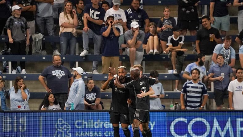 Sep 20, 2023; Kansas City, Kansas, USA; Nashville SC midfielder Hany Mukhtar (10) celebrates his goal scored against Sporting Kansas City with midfielder Dax McCarty (6) and midfielder Fafa Picault (7) during the second half at Children's Mercy Park. Mandatory Credit: Denny Medley-USA TODAY Sports