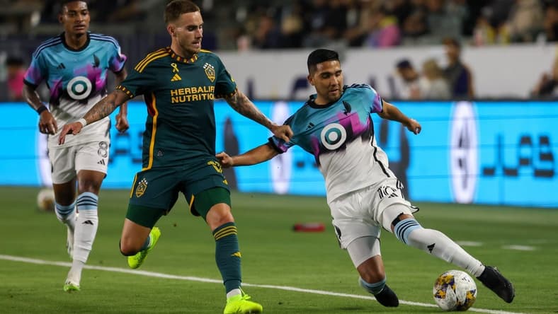 Sep 20, 2023; Carson, California, USA; Minnesota United FC midfielder Emanuel Reynoso (10) fights for the ball during the first half against Los Angeles Galaxy at Dignity Health Sports Park. Mandatory Credit: Kiyoshi Mio-USA TODAY Sports