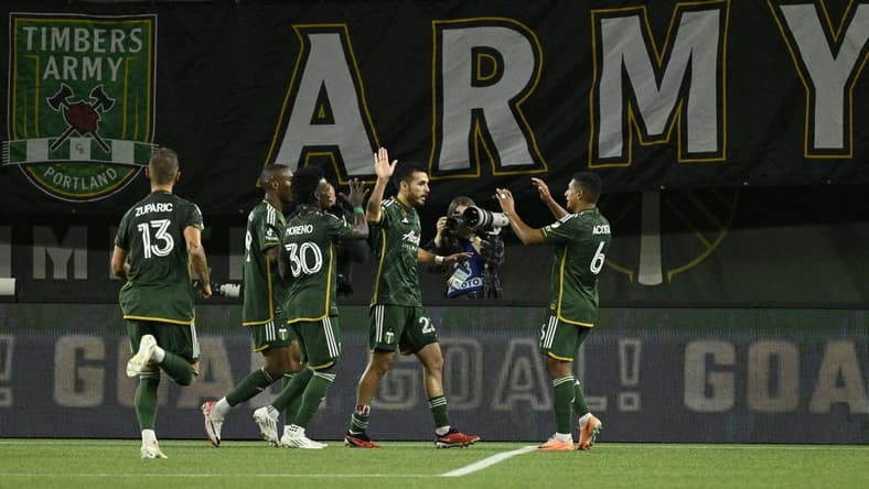 Sep 20, 2023; Portland, Oregon, USA;  Portland Timbers midfielder Cristhian Paredes (22) celebrates with teammates after scoring against San Jose Earthquakes during the first half at Providence Park. Mandatory Credit: Troy Wayrynen-USA TODAY Sports
