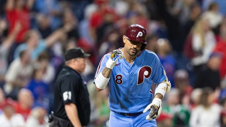 Sep 21, 2023; Philadelphia, Pennsylvania, USA; Philadelphia Phillies right fielder Nick Castellanos (8) tosses his bat after hitting a home run during the sixth inning against the New York Mets at Citizens Bank Park. Mandatory Credit: Bill Streicher-USA TODAY Sports