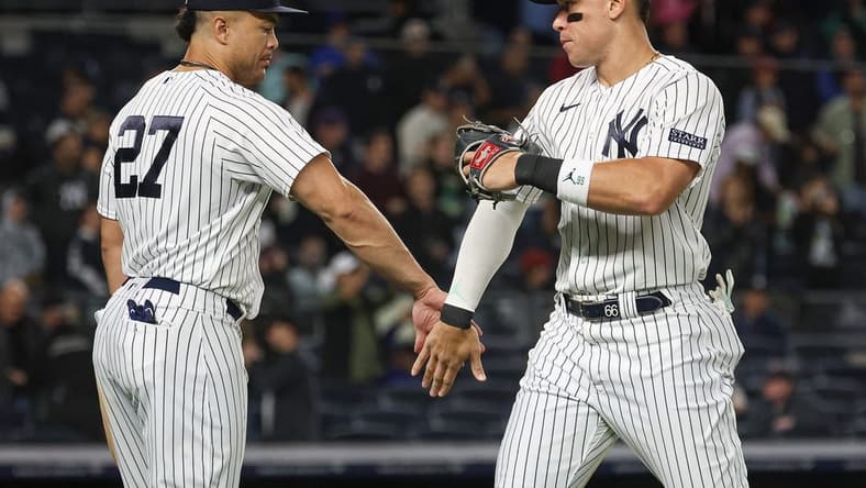 Sep 22, 2023; Bronx, New York, USA; New York Yankees right fielder Aaron Judge (99) celebrates with designated hitter Giancarlo Stanton (27) after defeating the Arizona Diamondbacks at Yankee Stadium. Mandatory Credit: Vincent Carchietta-USA TODAY Sports
