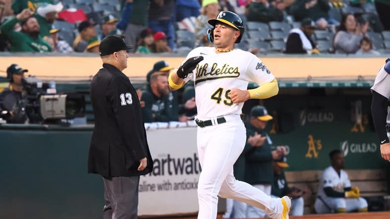 Sep 22, 2023; Oakland, California, USA; Oakland Athletics first baseman Ryan Noda (49) scores a run against the Detroit Tigers during the first inning at Oakland-Alameda County Coliseum. Mandatory Credit: Kelley L Cox-USA TODAY Sports