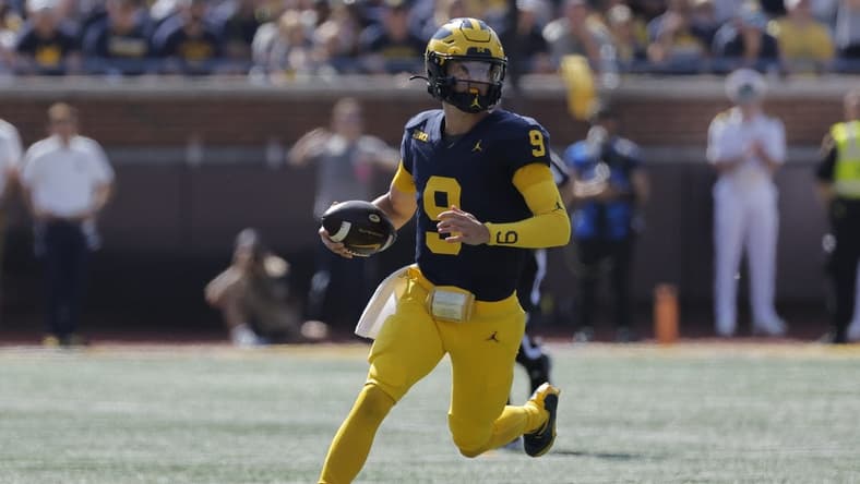 Sep 23, 2023; Ann Arbor, Michigan, USA;  Michigan Wolverines quarterback J.J. McCarthy (9) runs the ball against the Rutgers Scarlet Knights in the first half at Michigan Stadium. Mandatory Credit: Rick Osentoski-USA TODAY Sports