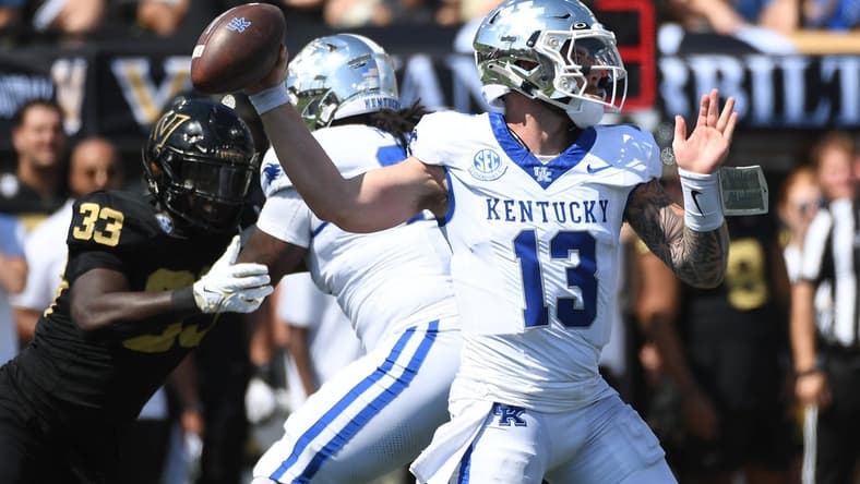 Sep 23, 2023; Nashville, Tennessee, USA; Kentucky Wildcats quarterback Devin Leary (13) throws a pass against the Vanderbilt Commodores during the first half at FirstBank Stadium. Mandatory Credit: Christopher Hanewinckel-USA TODAY Sports