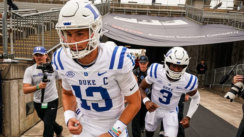 Sep 23, 2023; East Hartford, Connecticut, USA; Duke Blue Devils quarterback Riley Leonard (13) heads onto the field to warm up before the start of the game against the UConn Huskies at Rentschler Field at Pratt & Whitney Stadium. Mandatory Credit: David Butler II-USA TODAY Sports