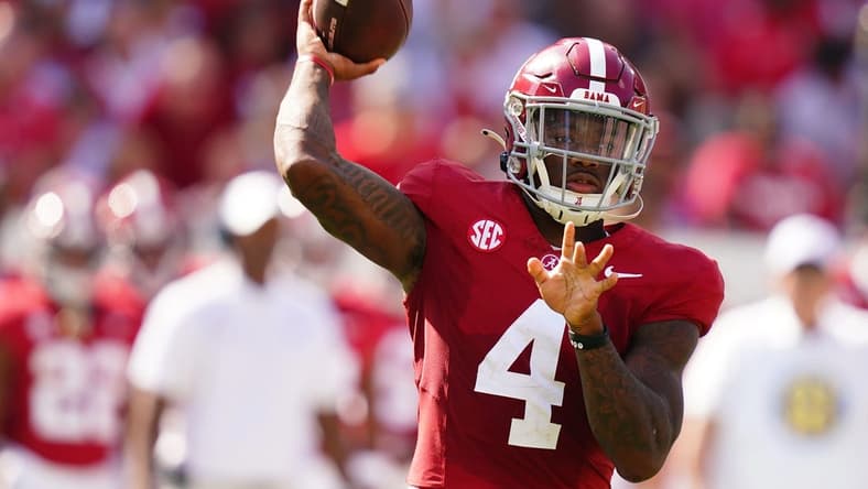 Sep 23, 2023; Tuscaloosa, Alabama, USA; Alabama Crimson Tide quarterback Jalen Milroe (4) looks to pass against the Mississippi Rebels during the first quarter at Bryant-Denny Stadium. Mandatory Credit: John David Mercer-USA TODAY Sports