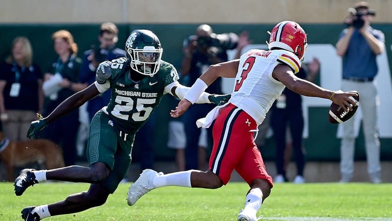 Sep 23, 2023; East Lansing, Michigan, USA;  Michigan State Spartans defensive back Chance Rucker (25) chases Maryland Terrapins quarterback Taulia Tagovailoa (3) out of the pocket in the first quarter at Spartan Stadium. Mandatory Credit: Dale Young-USA TODAY Sports