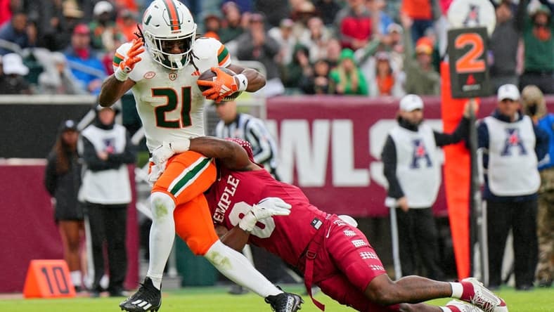Sep 23, 2023; Philadelphia, Pennsylvania, USA;  Temple Owls safety Alex Odom (8) can   t stop Miami Hurricanes running back Henry Parrish Jr. (21) from scoring a touchdown in the second half against the Temple Owls at Lincoln Financial Field. Mandatory Credit: Andy Lewis-USA TODAY Sports