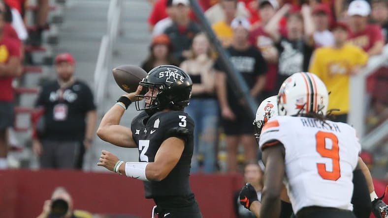 Iowa State Cyclones' quarterback Rocco Becht (3) passes the ball around Oklahoma State Cowboys' safety Trey Rucker (9)during the first quarter of an NCAA college football game at Jack Trice Stadium on Saturday, Sept. 23, 2023, in Ames, Iowa.