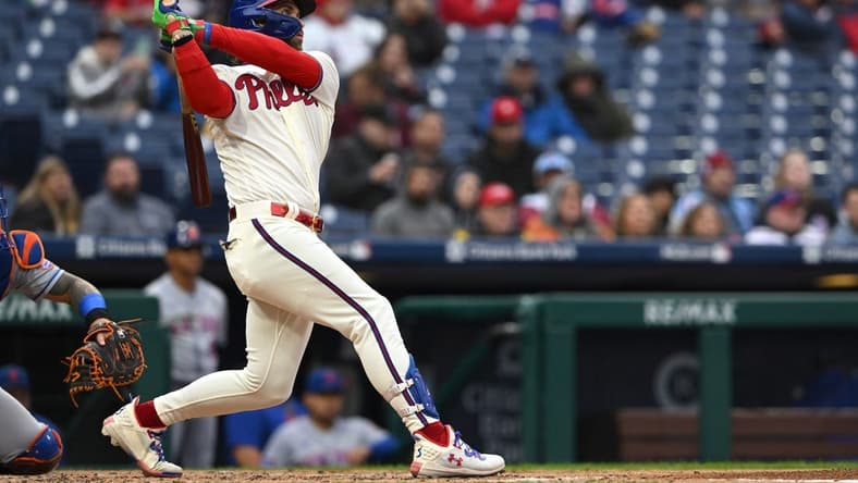 Sep 23, 2023; Philadelphia, Pennsylvania, USA; Philadelphia Phillies designated hitter Bryce Harper (3) hits a solo home run in the second inning against the New York Mets at Citizens Bank Park. Mandatory Credit: John Geliebter-USA TODAY Sports
