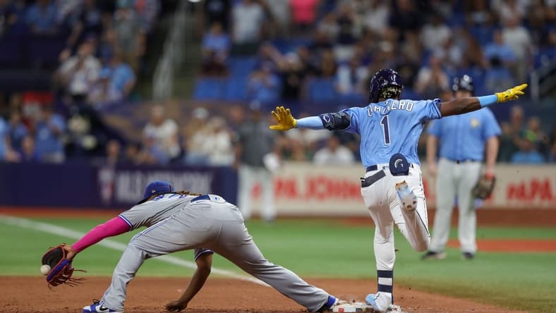 Sep 23, 2023; St. Petersburg, Florida, USA; Tampa Bay Rays designated hitter Junior Caminero (1) is safe at first after an overturned out call against the Toronto Blue Jays in the ninth inning at Tropicana Field. Mandatory Credit: Nathan Ray Seebeck-USA TODAY Sports