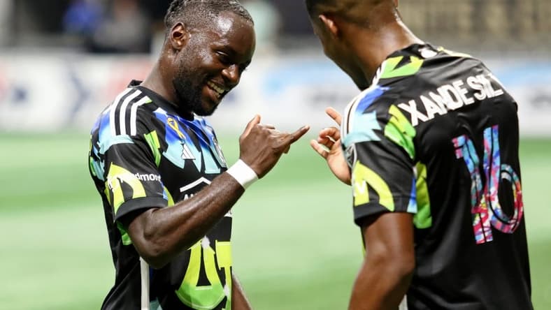 Sep 23, 2023; Atlanta, Georgia, USA; Atlanta United forward Xande Silva (right) celebrates after scoring a goal against CF Montreal with midfielder Tristan Muyumba (8) during the first half at Mercedes-Benz Stadium. Mandatory Credit: Jordan Godfree-USA TODAY Sports