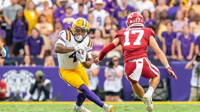 Runningback John Emery Jr 4 runs the ball as the LSU Tigers take on the Arkansas Razorbacks at Tiger Stadium in Baton Rouge, Louisiana, Sept. 23, 2023.