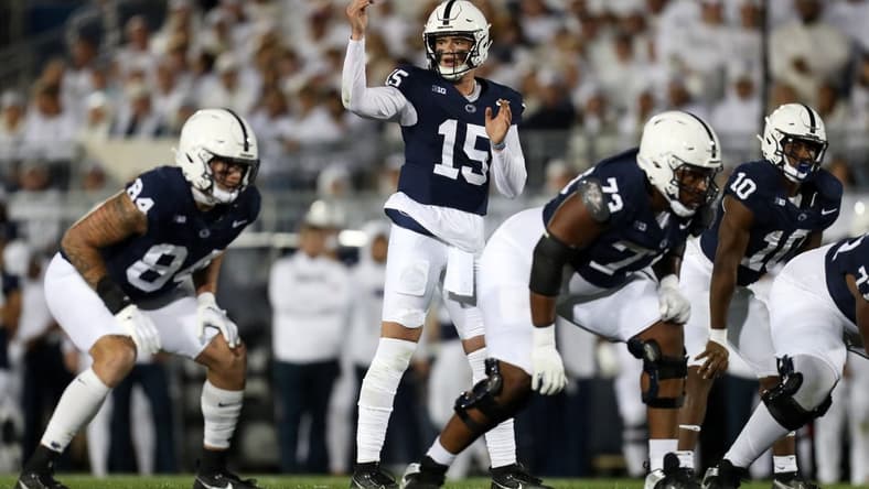Sep 23, 2023; University Park, Pennsylvania, USA; Penn State Nittany Lions quarterback Drew Allar (15) gestures from the line of scrimmage during the first quarter against the Iowa Hawkeyes at Beaver Stadium. Mandatory Credit: Matthew O'Haren-USA TODAY Sports