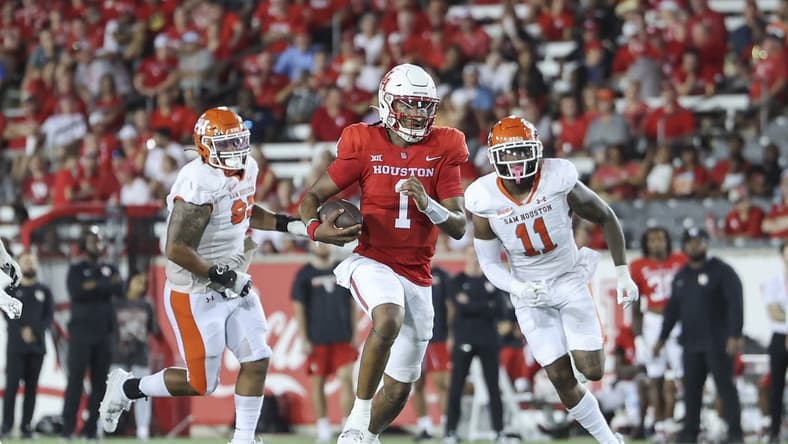 Sep 23, 2023; Houston, Texas, USA; Houston Cougars quarterback Donovan Smith (1) runs with the ball during the third quarter against the Sam Houston State Bearkats at TDECU Stadium. Mandatory Credit: Troy Taormina-USA TODAY Sports