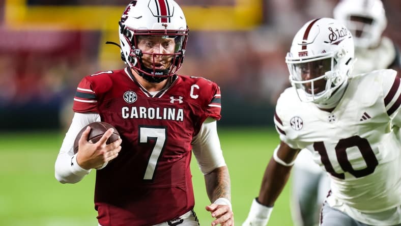 Sep 23, 2023; Columbia, South Carolina, USA; South Carolina Gamecocks quarterback Spencer Rattler (7) scrambles against the Mississippi State Bulldogs in the second half at Williams-Brice Stadium. Mandatory Credit: Jeff Blake-USA TODAY Sports