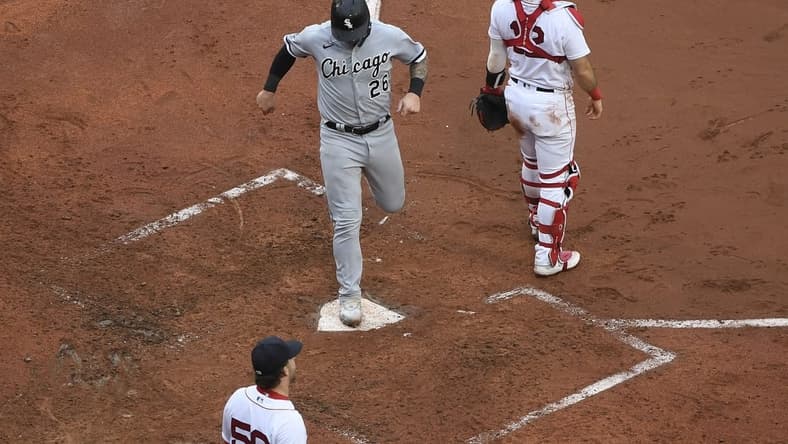 Sep 24, 2023; Boston, Massachusetts, USA; Chicago White Sox catcher Korey Lee (26) scores a run during the fifth inning against the Boston Red Sox at Fenway Park. Mandatory Credit: Bob DeChiara-USA TODAY Sports