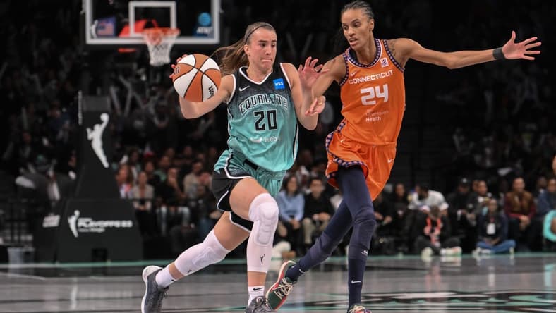 Sep 26, 2023; Brooklyn, New York, USA; New York Liberty guard Sabrina Ionescu (20) drives to the basket against Connecticut Sun forward DeWanna Bonner (24) during the second half of game two of the 2023 WNBA Playoffs at Barclays Center. Mandatory Credit: John Jones-USA TODAY Sports