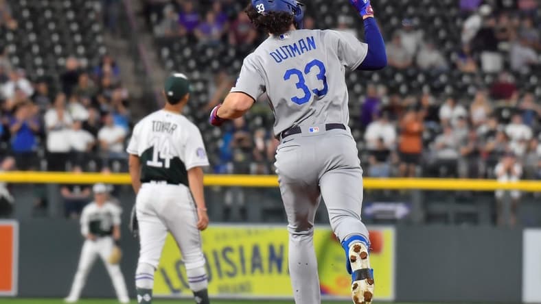 Sep 27, 2023; Denver, Colorado, USA; Los Angeles Dodgers center fielder James Outman (33) pumps his fist after hitting a 382ft home run off of Colorado Rockies starting pitcher Noah Davis (63) during the third inning at Coors Field. Mandatory Credit: John Leyba-USA TODAY Sports
