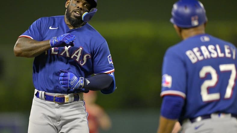 Sep 27, 2023; Anaheim, California, USA; Texas Rangers right fielder Adolis Garcia (53) taps his chest as he rounds the bases after a solo home run in the third inning against the Los Angeles Angels at Angel Stadium. Mandatory Credit: Jayne Kamin-Oncea-USA TODAY Sports