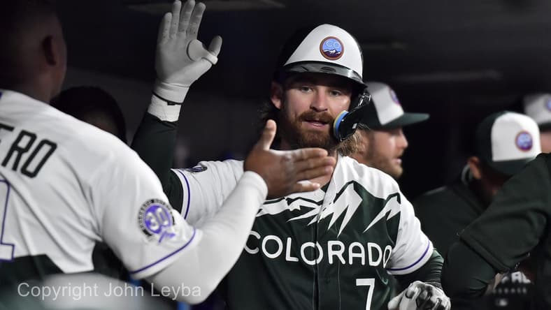 Sep 27, 2023; Denver, Colorado, USA; Colorado Rockies second baseman Brendan Rodgers (7) gets a high five from Elehuris Montero after his home run during the sixth inning against the Los Angeles Dodgers at Coors Field. Mandatory Credit: John Leyba-USA TODAY Sports