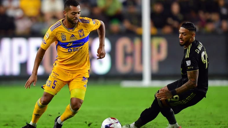 Sep 27, 2023; Los Angeles, CA, USA; Los Angeles FC forward Denis Bouanga (99) and Tigres UANL midfielder Rafael Carioca (5) battle for the ball in the second half at BMO Stadium. Mandatory Credit: Gary A. Vasquez-USA TODAY Sports