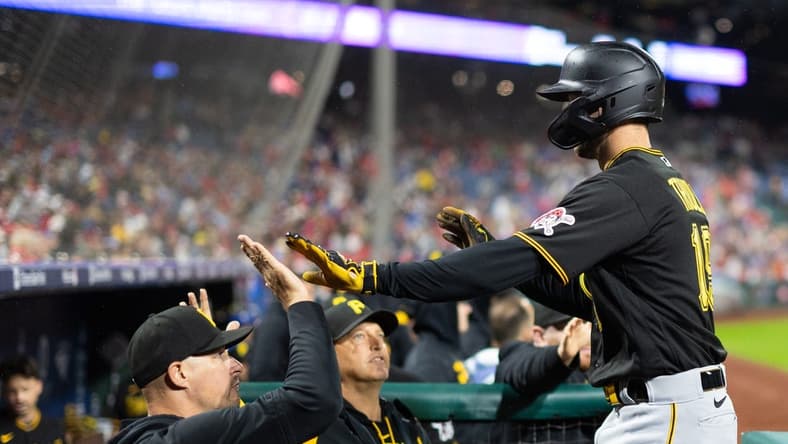 Sep 28, 2023; Philadelphia, Pennsylvania, USA; Pittsburgh Pirates third baseman Jared Triolo (19) is congratulated after scoring against the Philadelphia Phillies during the fifth inning at Citizens Bank Park. Mandatory Credit: Bill Streicher-USA TODAY Sports