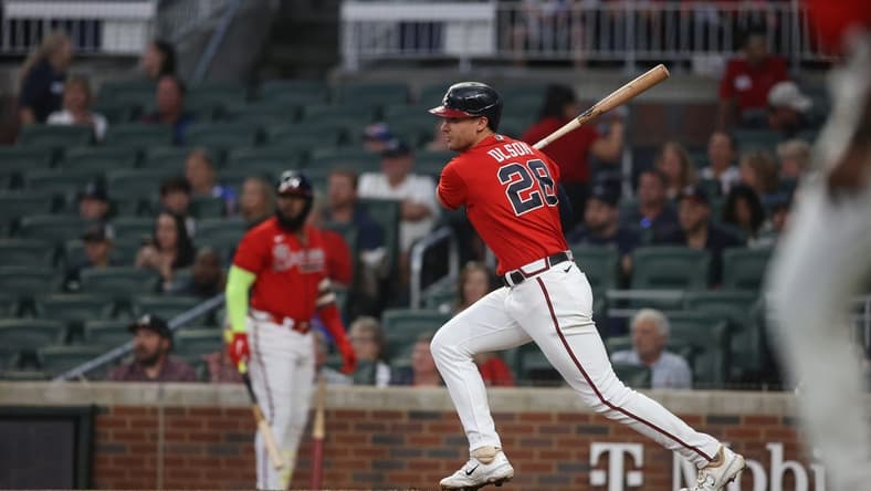 Sep 29, 2023; Atlanta, Georgia, USA; Atlanta Braves first baseman Matt Olson (28) hits a RBI single against the Washington Nationals in the first inning at Truist Park. Mandatory Credit: Brett Davis-USA TODAY Sports