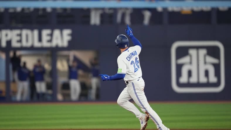 Sep 29, 2023; Toronto, Ontario, CAN; Toronto Blue Jays third baseman Matt Chapman (26) runs the bases and celebrates after hitting a home run against the Tampa Bay Rays during the fifth inning at Rogers Centre. Mandatory Credit: Nick Turchiaro-USA TODAY Sports