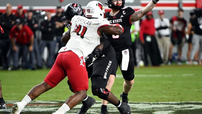 Sep 29, 2023; Raleigh, North Carolina, USA; North Carolina State Wolfpack quarterback Brennan Armstrong (5) throws a pass during the first half against the Louisville Cardinals at Carter-Finley Stadium. Mandatory Credit: Rob Kinnan-USA TODAY Sports