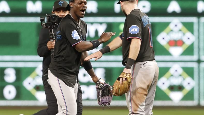 Sep 29, 2023; Pittsburgh, Pennsylvania, USA; Miami Marlins center fielder Jazz Chisholm Jr. (2) and shortstop Garrett Hampson (1) celebrate after defeating the Pittsburgh Pirates at PNC Park. Miami won 4-3. Mandatory Credit: Charles LeClaire-USA TODAY Sports