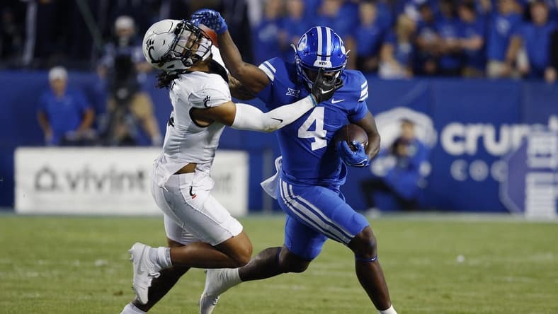 Sep 29, 2023; Provo, Utah, USA; Cincinnati Bearcats safety Deshawn Pace (3) covers Brigham Young Cougars running back Miles Davis (4) in the first half at LaVell Edwards Stadium. Mandatory Credit: Jeff Swinger-USA TODAY Sports