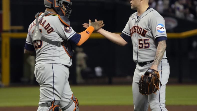 Sep 29, 2023; Phoenix, Arizona, USA; Houston Astros catcher Martin Maldonado (15) and pitcher Ryan Pressly (55) celebrates after defeating the Arizona Diamondbacks at Chase Field. Mandatory Credit: Rick Scuteri-USA TODAY Sports