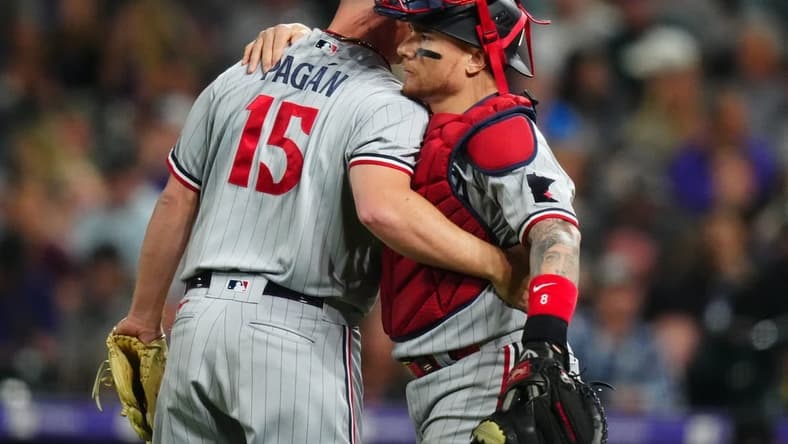 Sep 29, 2023; Denver, Colorado, USA; Minnesota Twins relief pitcher Emilio Pagan (15) and catcher Christian Vazquez (8) celebrate defeating the Colorado Rockies at Coors Field. Mandatory Credit: Ron Chenoy-USA TODAY Sports
