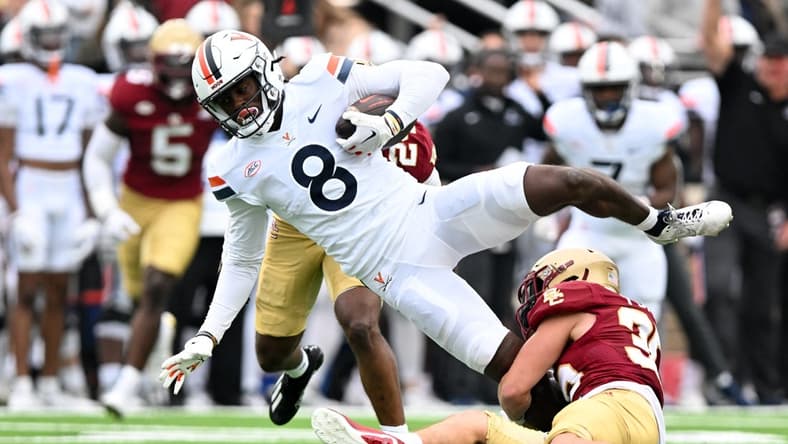 Sep 30, 2023; Chestnut Hill, Massachusetts, USA; Virginia Cavaliers wide receiver Malachi Fields (8) is tackled by Boston College Eagles defensive back John Pupel (35) during the first half at Alumni Stadium. Mandatory Credit: Brian Fluharty-USA TODAY Sports