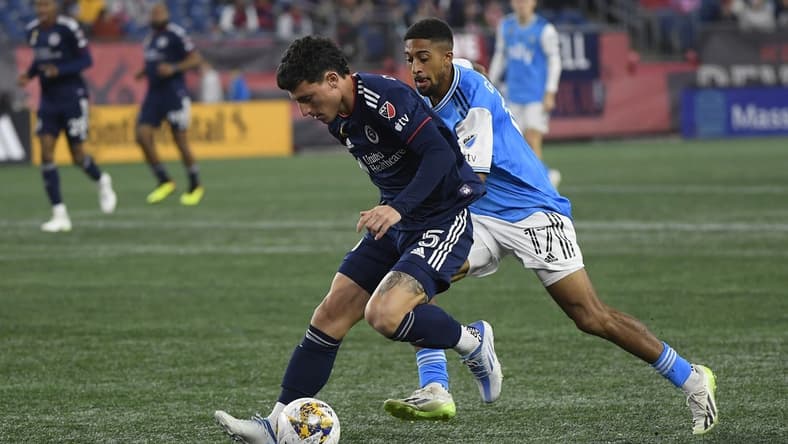 Sep 30, 2023; Foxborough, Massachusetts, USA; New England Revolution forward Tom s Chancalay (5) and Charlotte FC midfielder McKinze Gaines (17) battle for the ball during the first half at Gillette Stadium. Mandatory Credit: Bob DeChiara-USA TODAY Sports