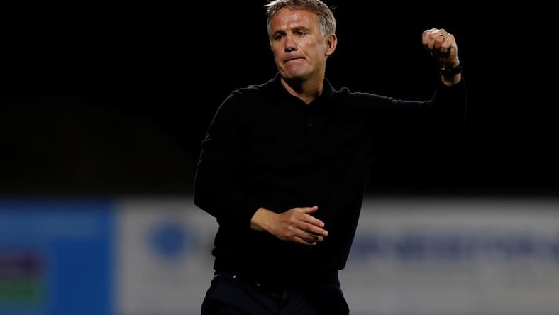 Wrexham manager Phil Parkinson celebrates winning a penalty shootout against Wigan Athletic at the Racecourse Ground in Wrexham, Wales, Britain on Aug. 8, 2023. (Action Images/Jason Cairnduff)