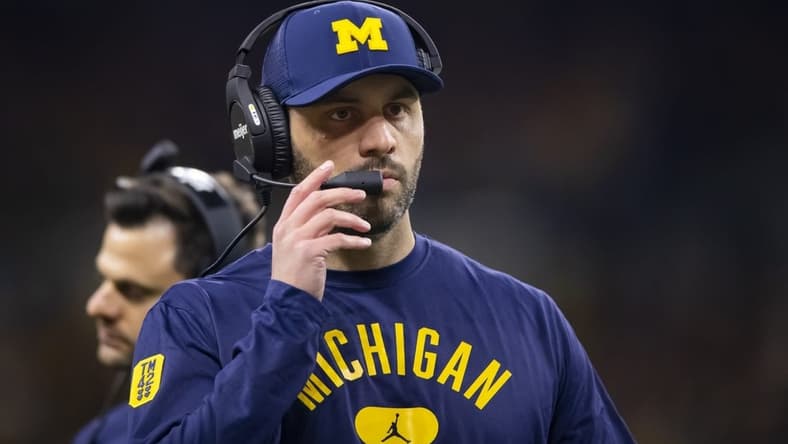 Dec 4, 2021; Indianapolis, IN, USA; Michigan Wolverines quarterbacks coach Matt Weiss against the Iowa Hawkeyes in the Big Ten Conference championship game at Lucas Oil Stadium. Mandatory Credit: Mark J. Rebilas-USA TODAY Sports