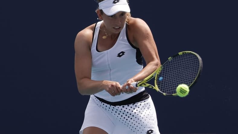 Mar 25, 2022; Miami Gardens, FL, USA; Elise Mertens (BEL) hits a backhand against Linda Fruhvirtova (CZE) (not pictured) in a second round women's match in the Miami Open at Hard Rock Stadium. Mandatory Credit: Geoff Burke-USA TODAY Sports