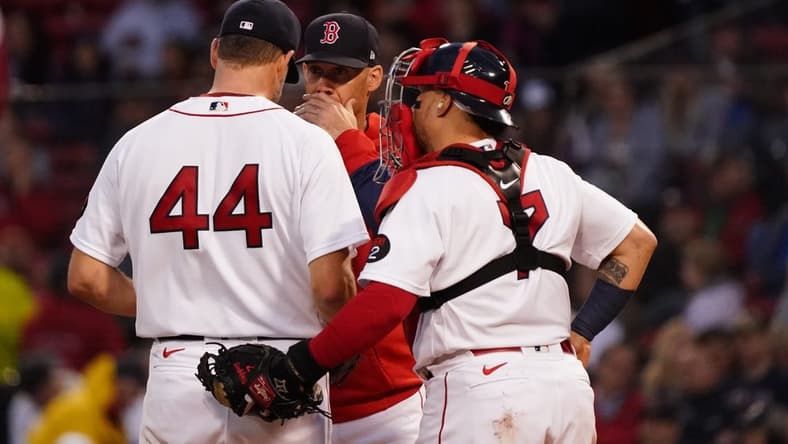 May 19, 2022; Boston, Massachusetts, USA; Boston Red Sox pitching coach Dave Bush (58) talks with starting pitcher Rich Hill (44) against the Seattle Mariners in the second inning at Fenway Park. Mandatory Credit: David Butler II-USA TODAY Sports