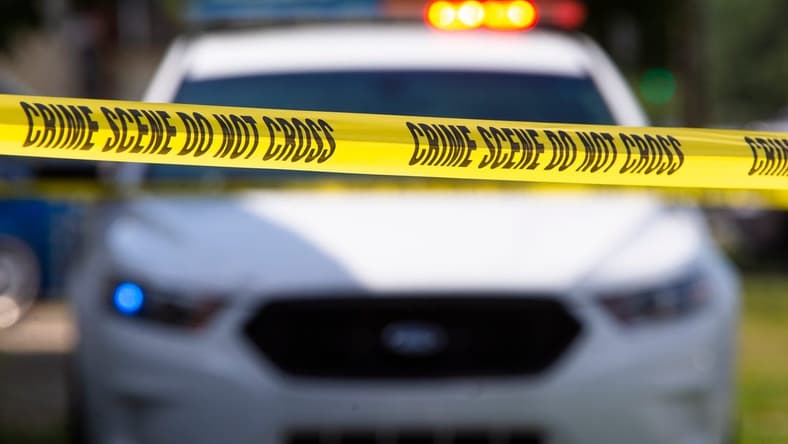 Crime scene tape near a squad car.
Police File Photo