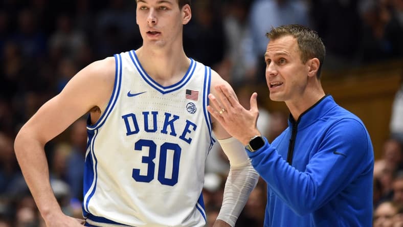Nov 30, 2022; Durham, North Carolina, USA; Duke Blue Devils head coach Jon Scheyer (right) gives instructions to  center Kyle Filipowski(30)  during the second half against the Ohio State Buckeyes at Cameron Indoor Stadium.  The Blue Devils won 81-72. Mandatory Credit: Rob Kinnan-USA TODAY Sports