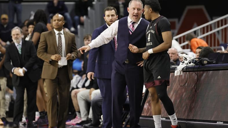 Jan 25, 2023; Auburn, Alabama, USA;  Texas A&M Aggies guard Wade Taylor IV (4) talks with head coach Buzz Williams in the final seconds as the Aggies beat the Auburn Tigers at Neville Arena. Mandatory Credit: John Reed-USA TODAY Sports
