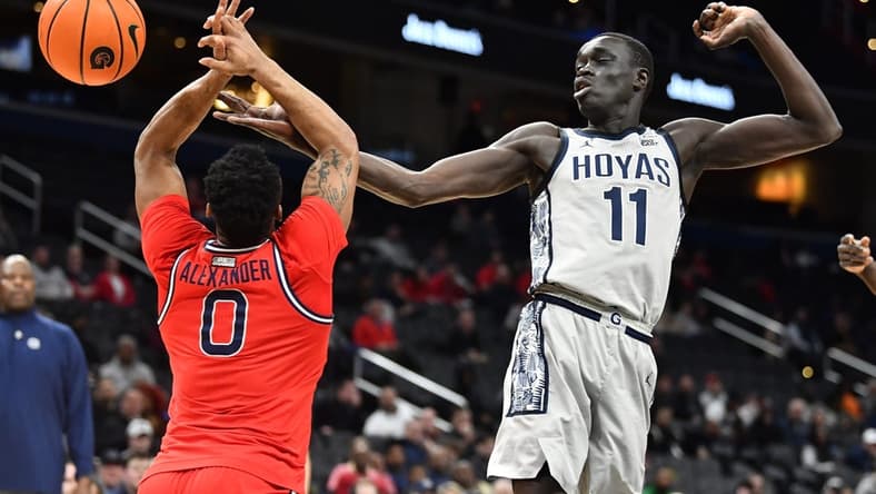 Feb 22, 2023; Washington, District of Columbia, USA; Georgetown Hoyas forward Akok Akok (11) and St. John's Red Storm guard Posh Alexander (0) battle for a rebound during the first half at Capital One Arena. Mandatory Credit: Brad Mills-USA TODAY Sports
