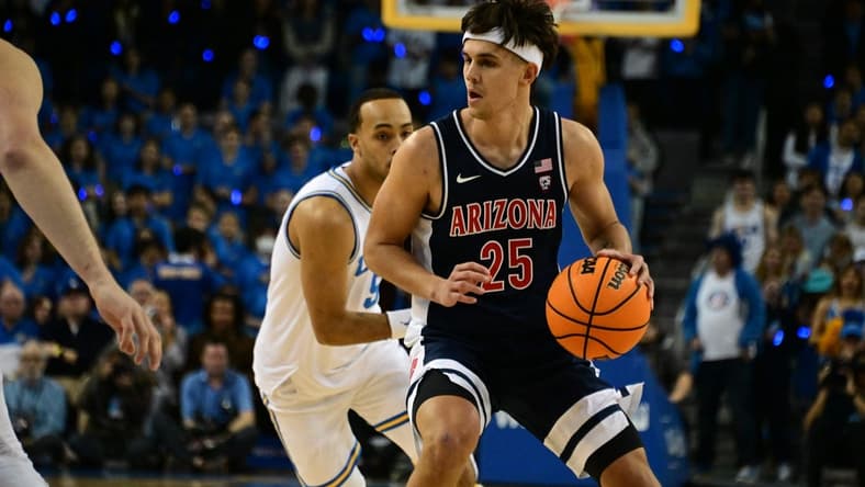 Mar 4, 2023; Los Angeles, California, USA;  Arizona Wildcats guard Kerr Kriisa (25) controls the ball as UCLA Bruins defends during the first half at Pauley Pavilion presented by Wescom. Mandatory Credit: Richard Mackson-USA TODAY Sports