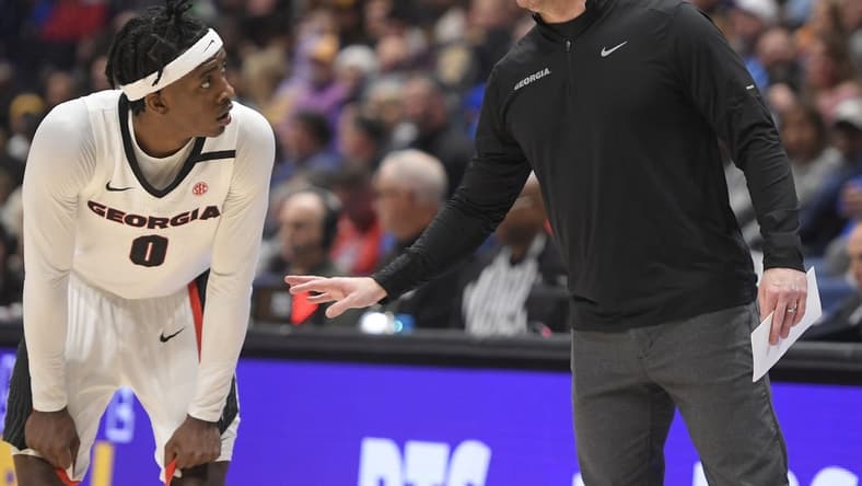 Mar 8, 2023; Nashville, TN, USA;  Georgia Bulldogs head coach Mike White talks with guard Terry Roberts (0) against the LSU Tigers during the first half at Bridgestone Arena. Mandatory Credit: Steve Roberts-USA TODAY Sports