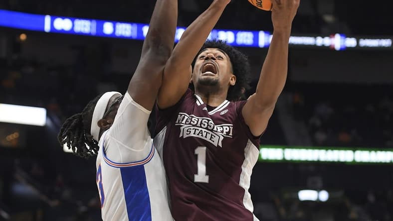 Mar 9, 2023; Nashville, TN, USA;  Mississippi State Bulldogs forward Tolu Smith (1) shoots over Florida Gators center Jason Jitoboh (33) during the first half at Bridgestone Arena. Mandatory Credit: Steve Roberts-USA TODAY Sports