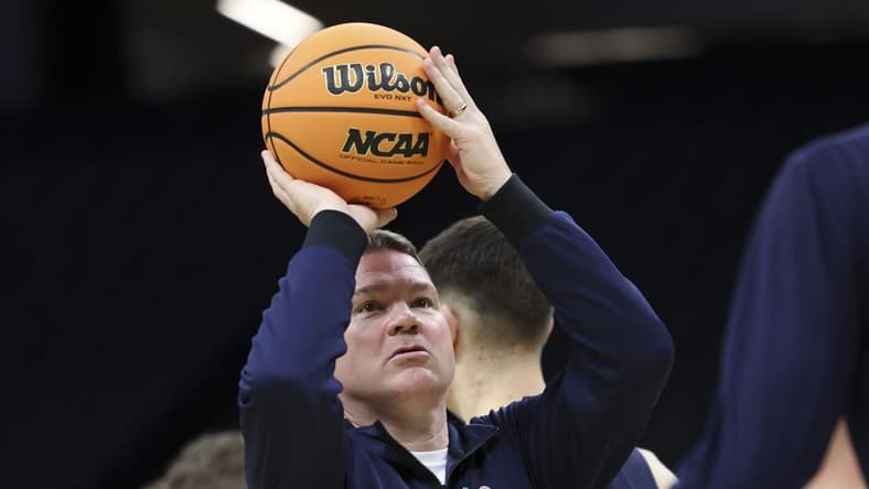 Mar 15, 2023; Sacramento, CA, USA; Arizona Wildcats head coach Tommy Lloyd shoots the basketball during practice day at Golden 1 Center. Mandatory Credit: Kelley L Cox-USA TODAY Sports