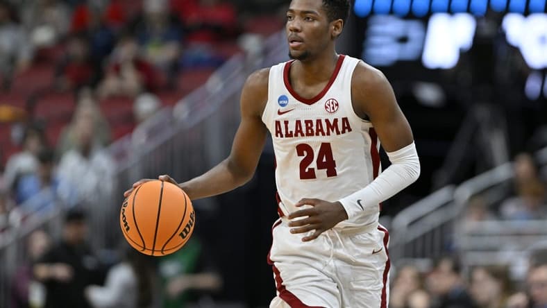 Mar 24, 2023; Louisville, KY, USA; Alabama Crimson Tide forward Brandon Miller (24) dribbles during the second half of the NCAA tournament round of sixteen against the San Diego State Aztecs at KFC YUM! Center. Mandatory Credit: Jamie Rhodes-USA TODAY Sports