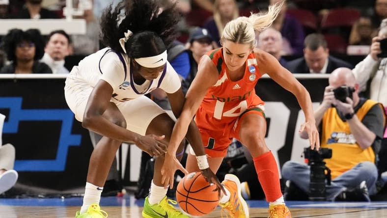 Mar 26, 2023; Greenville, SC, USA; LSU Lady Tigers guard Alexis Morris (45) and Miami Hurricanes guard Haley Cavinder (14) chase the loose ball during the second half in the NCAA Women   s Tournament at Bon Secours Wellness Arena. Mandatory Credit: Jim Dedmon-USA TODAY Sports